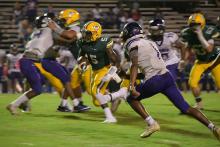 Gordo’s Troy Garner Jr. breaks through the Holt defense on the way to one of his two scores on Friday night.